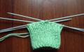We knit booties for newborns with knitting needles together